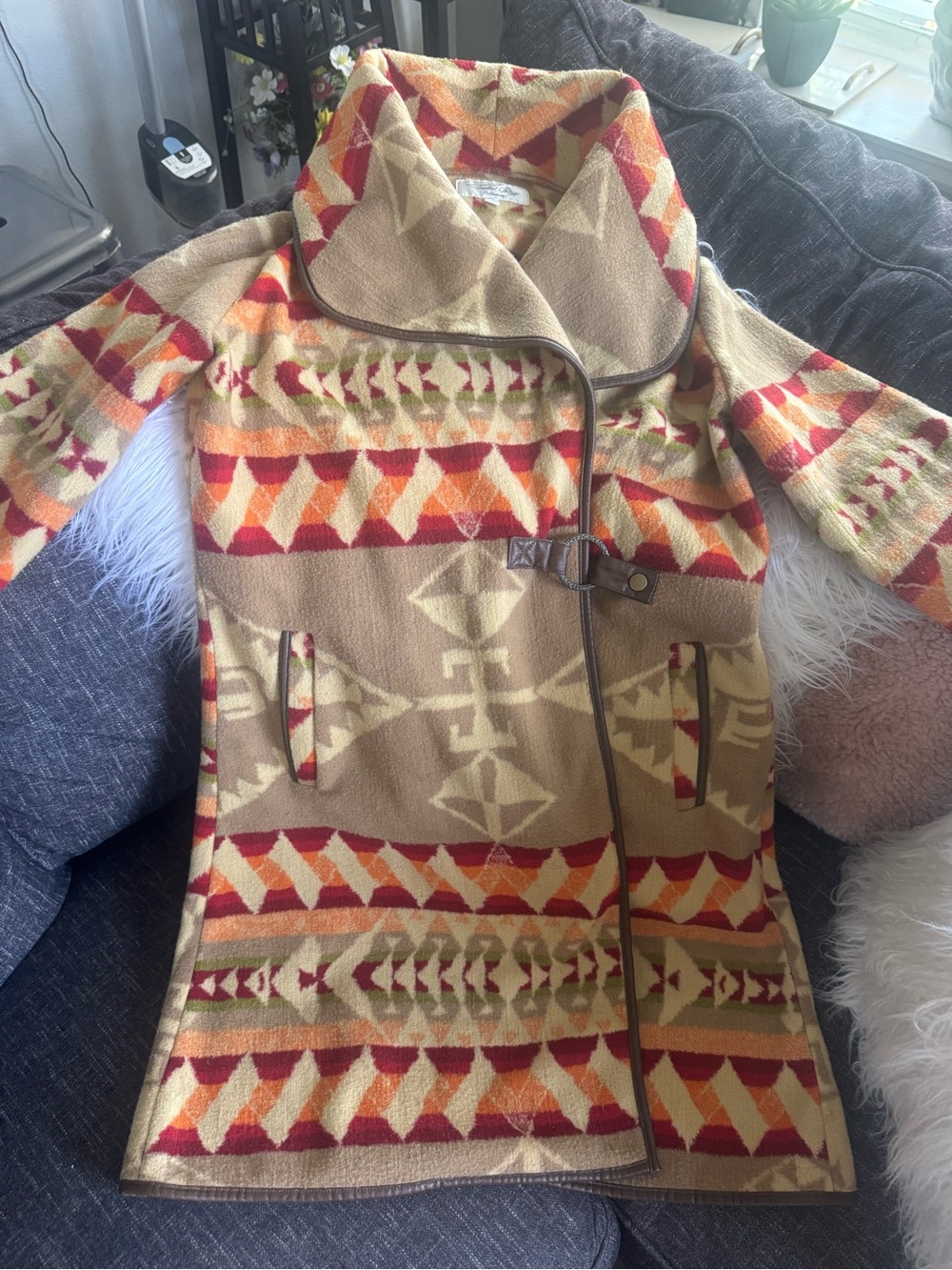 Tasha Polizzi Tan Trench Coat with Red and Orange Tribal Pattern